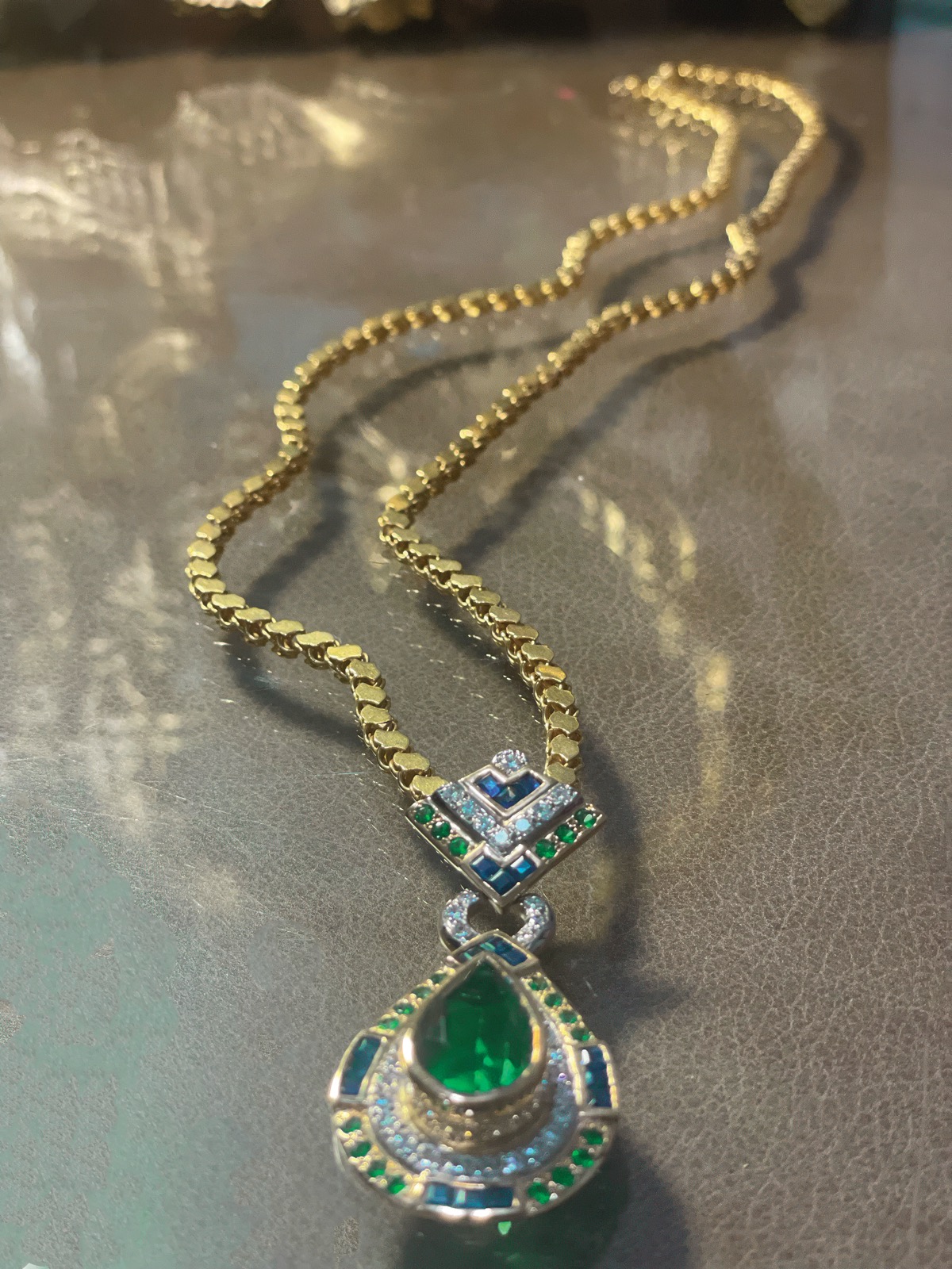 Emerald and diamond pendant necklace