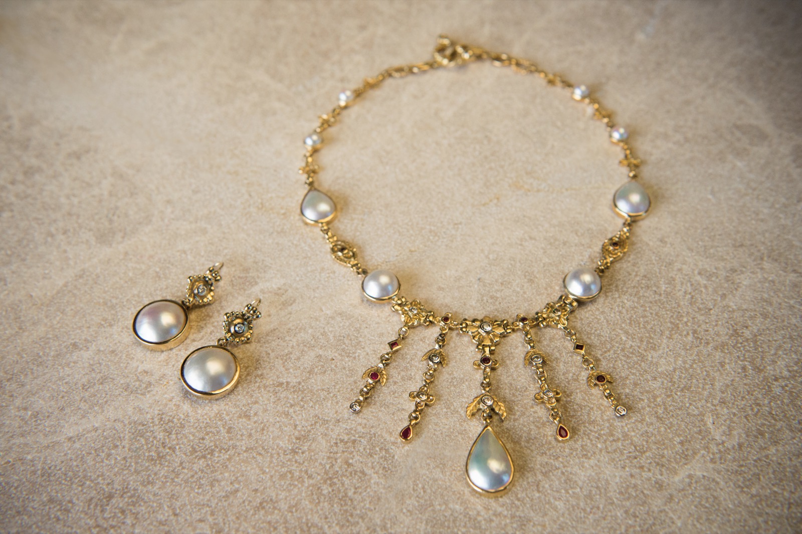 Geneviève Fleure Suite — pearl and gold necklace with matching earrings